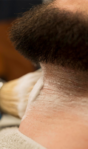 barber-using-shaving-cream-contour-male-customer-s-beard