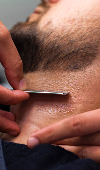 bearded-man-with-razor-blade